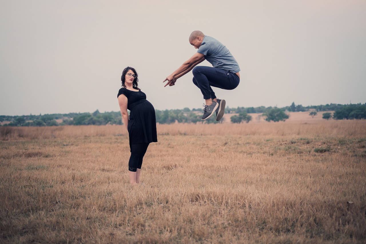 excited couple maternity shot